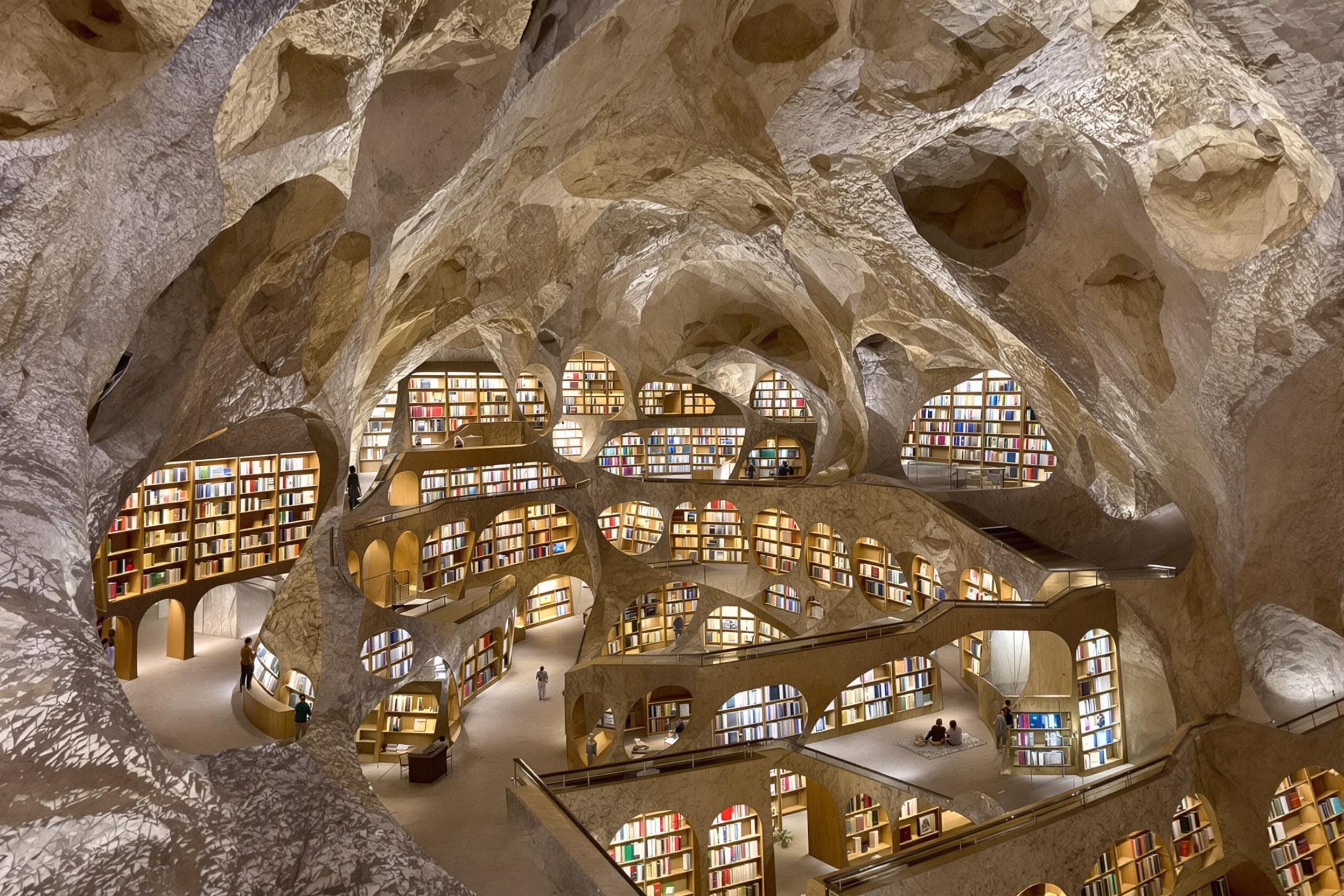 A breathtaking underground library carved into a natural limestone cave. This innovative architectural marvel seamlessly blends modern design with raw geological features, creating a unique space for learning and contemplation.