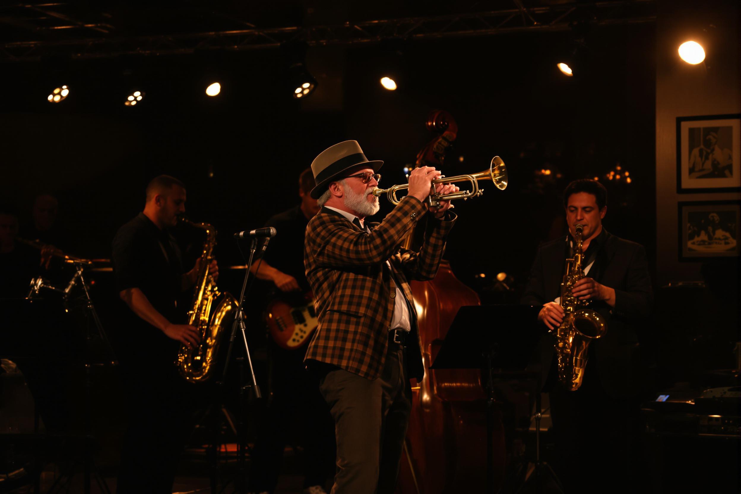 A jazz band performs energetically in an intimate venue, where warm spotlights illuminate the ensemble. The trumpet player, a middle-aged man with a fedora, takes center stage, passionately engaged in his solo. Surrounding him are musicians playing saxophones and a double bass, creating a dynamic atmosphere. Patrons enjoy the show from softly lit tables, their silhouettes blending into the lively background.