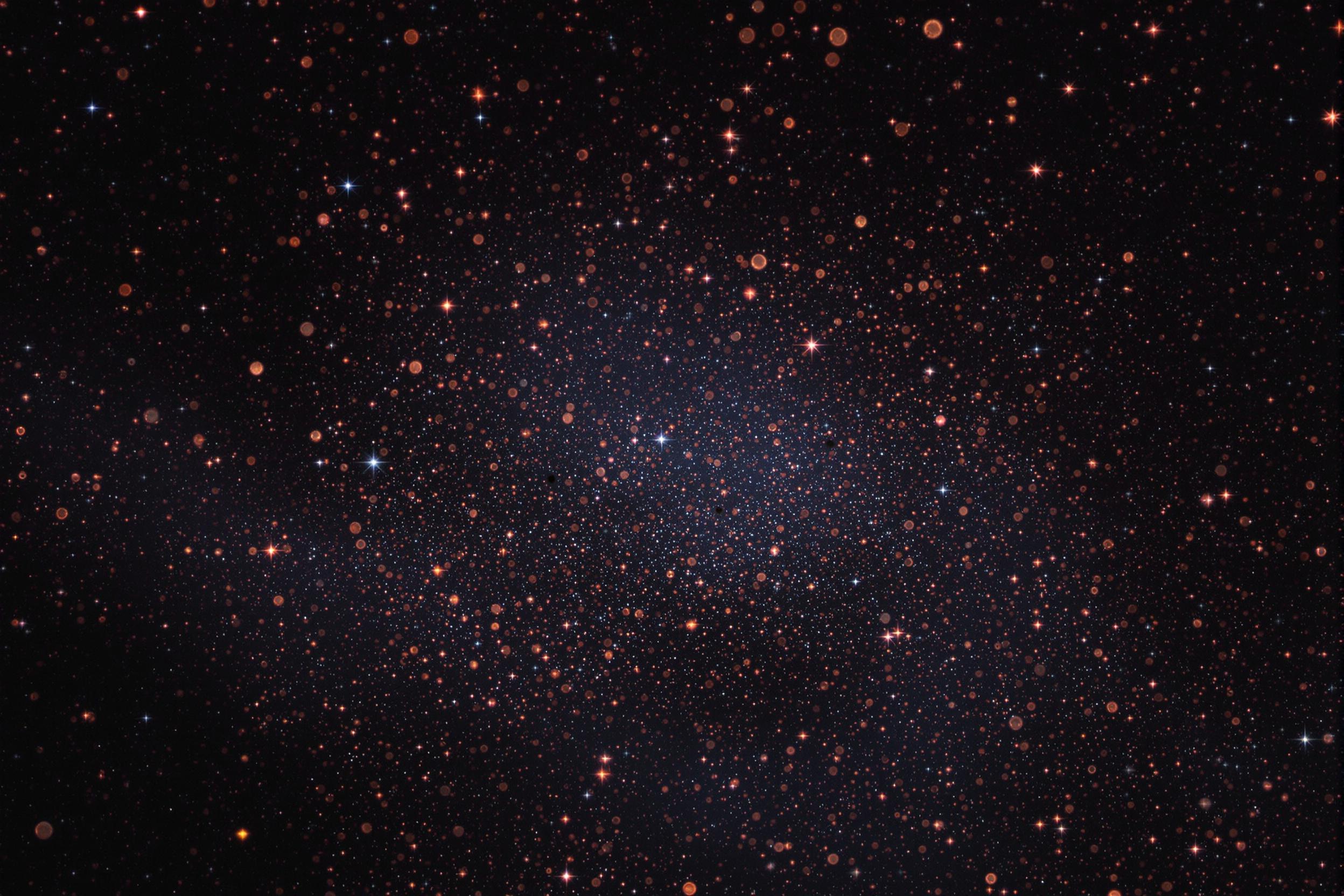 Mesmerizing close-up of cosmic dust particles floating in deep space, illuminated by the faint glow of distant stars. This captivating image showcases the intricate beauty of interstellar matter against the vast backdrop of the cosmos.