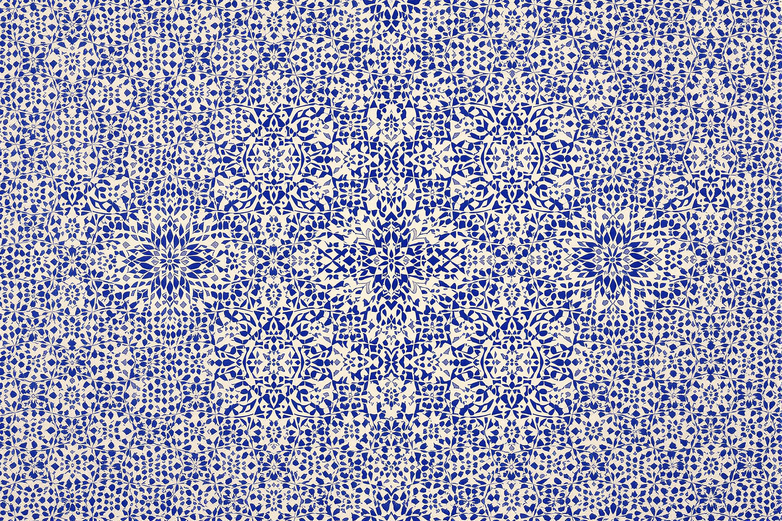 Intricate Moroccan zellige tilework in a kaleidoscope of blues and whites, creating a mesmerizing geometric pattern. This high-resolution wallpaper captures the essence of traditional Islamic art and architecture, perfect for design enthusiasts and cultural aesthetes.